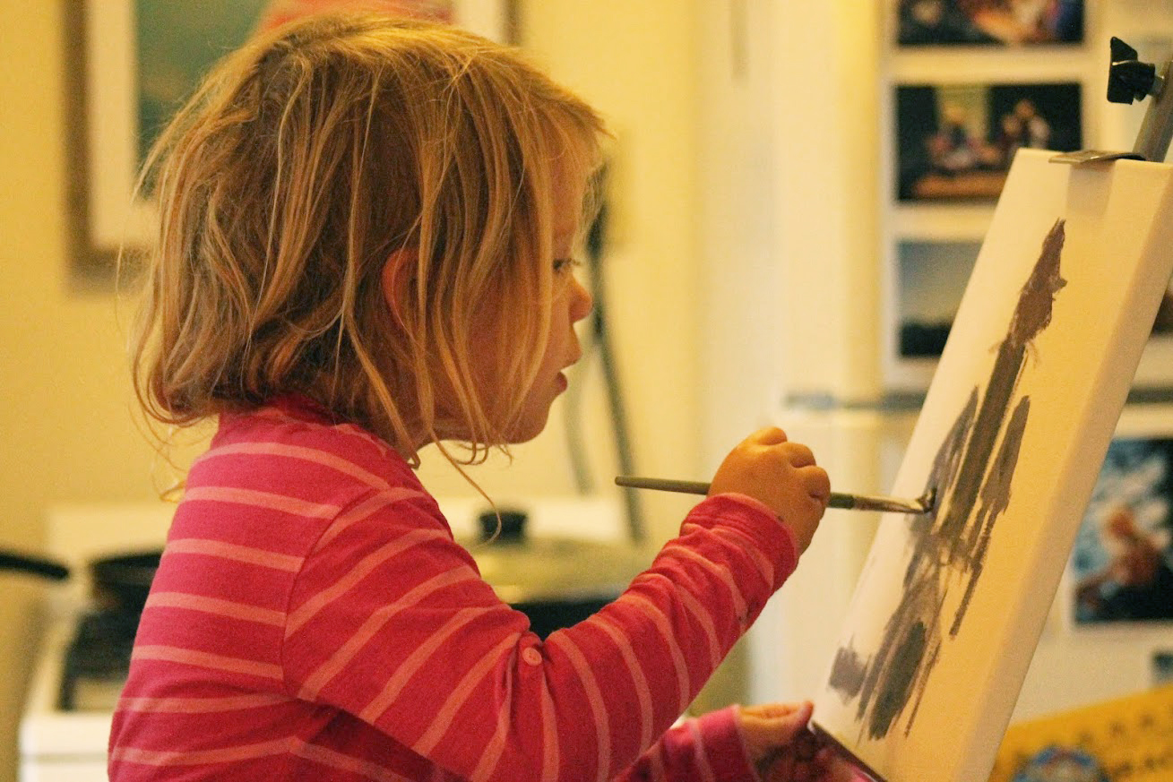 Children painting together at an Open Canvas Project art session
